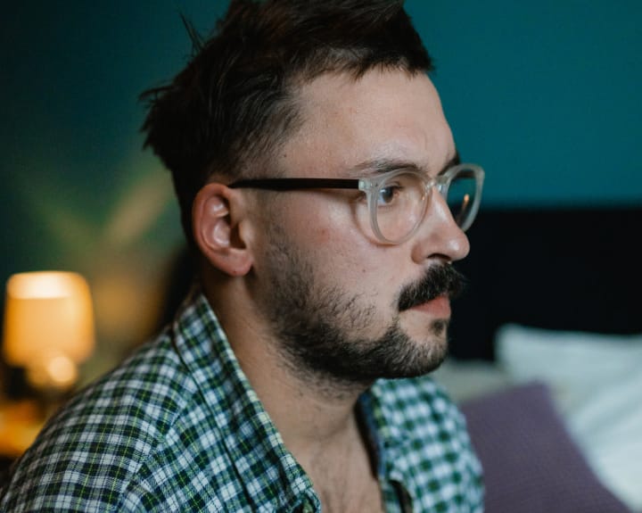 profile of a man with glasses