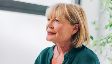 woman sitting looking ahead