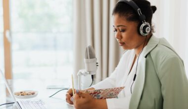 woman reading notes and looking at computer