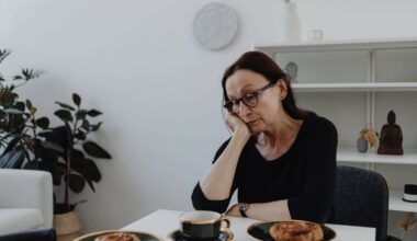 sad woman sitting at table