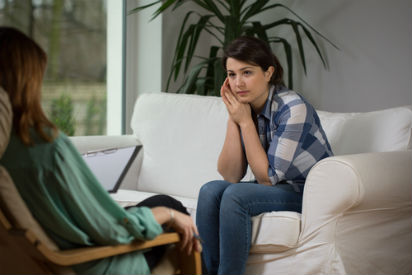 therapy working for woman on couch with therapist