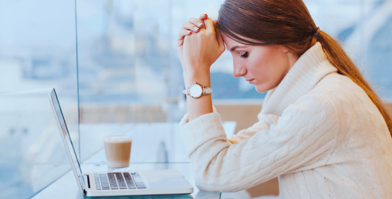 Young employee frustrated at her desk