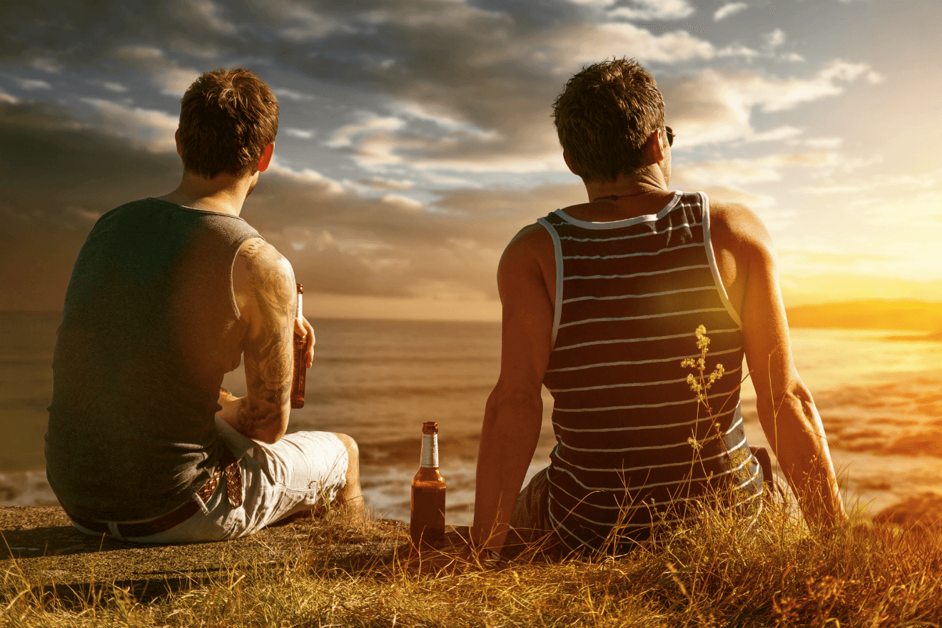 male best friends beer bottle sunset field