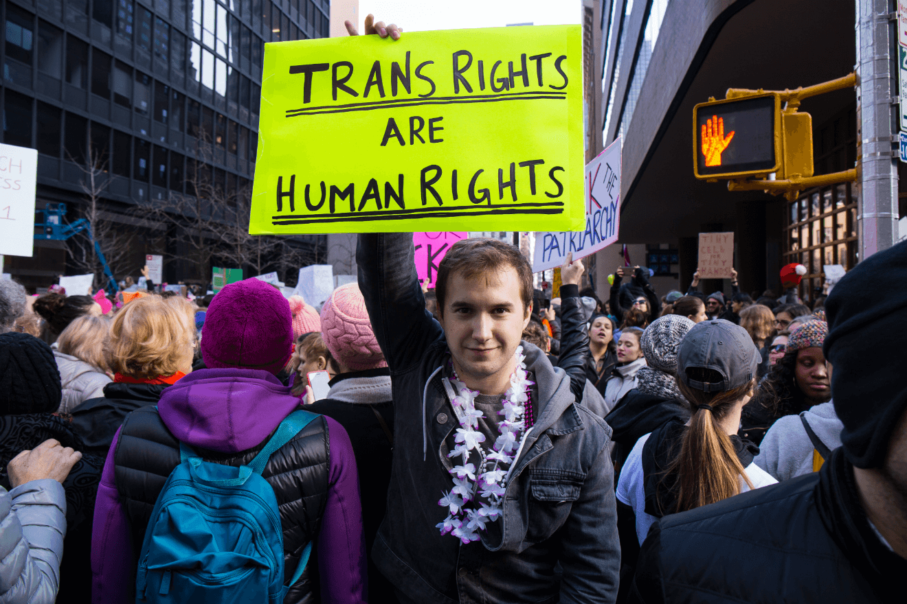 trans rights sign male activist rally